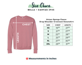 Bella Canvas 3945 Size chart for unisex sponge fleece drop should crewneck sweatshirt with size and mauve colored shirt on the left.