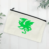 An off-white canvas zippered pouch featuring a bright green Welsh dragon graphic, displayed on a white paneled background with decorative green leaves in the corners.