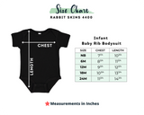 A size chart graphic for an infant baby rib bodysuit by Rabbit Skins 4400, showing a black short-sleeve bodysuit with chest and length measurement arrows, plus a size table listing sizes NB, 6M, 12M, 18M, and 24M with chest and length measurements in inches.