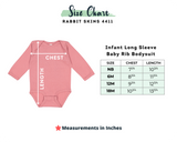 A size chart graphic for the Rabbit Skins 4411 Infant Long Sleeve Baby Rib Bodysuit. The image features a pink baby bodysuit with white arrows indicating chest and length measurements, alongside a size table listing measurements in inches for sizes NB, 6M, 12M, and 18M.